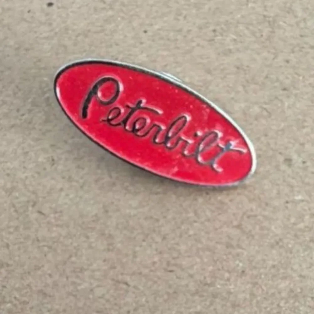 Vtg. Peterbilt red oval enamel trucking lapel pin enblem